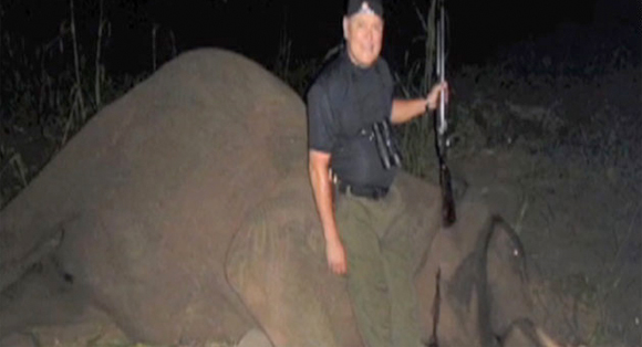 The proud CEO of GoDaddy, Bob Parsons, standing over his Elephant Kill